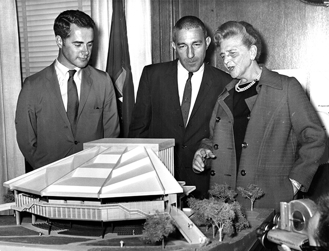 Architect Edward Knowles, Secretary of the Interior Stewart L. Udall, and Mrs. Shouse review the architectural model of the Filene Center on April 28, 1968.
