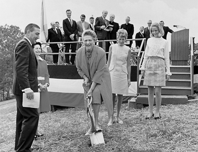 Mrs. Catherine Filene Shouse breaks ground on the Filene Center on May 22, 1968 as Secretary of the Interior Steward L. Udall and Lady Bird Johnson look on.