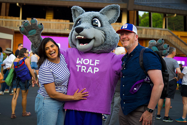 Wolf Trap patrons pose with Wolfie.