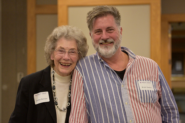 Volunteers Esther Benson and Bryan Swann smile at the camera.