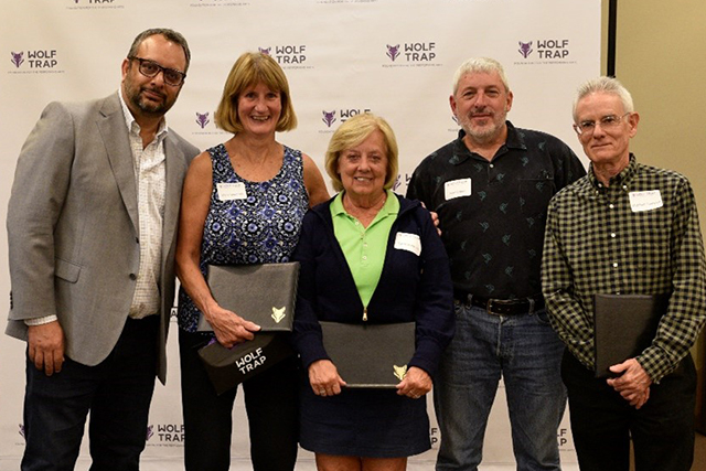 Arvind Manocha poses with the 2023 Volunteer Honorees.