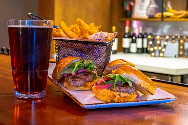 Lamb sliders, fries, and a glass of beer.