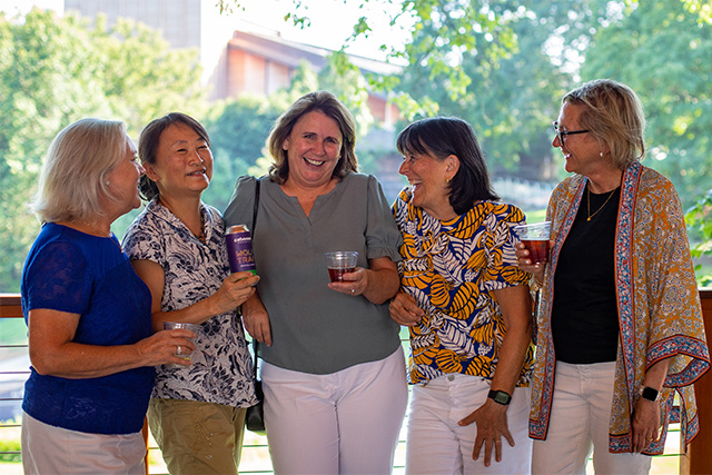 Wolf Trap volunteer Chunyen raises a glass with her fellow volunteers.