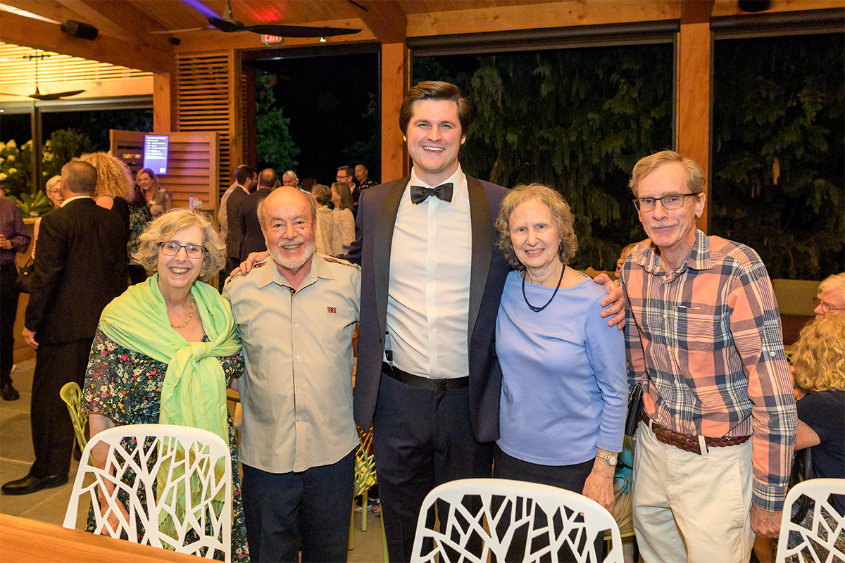 Wolf Trap members greet a Wolf Trap Opera artist at a reception.