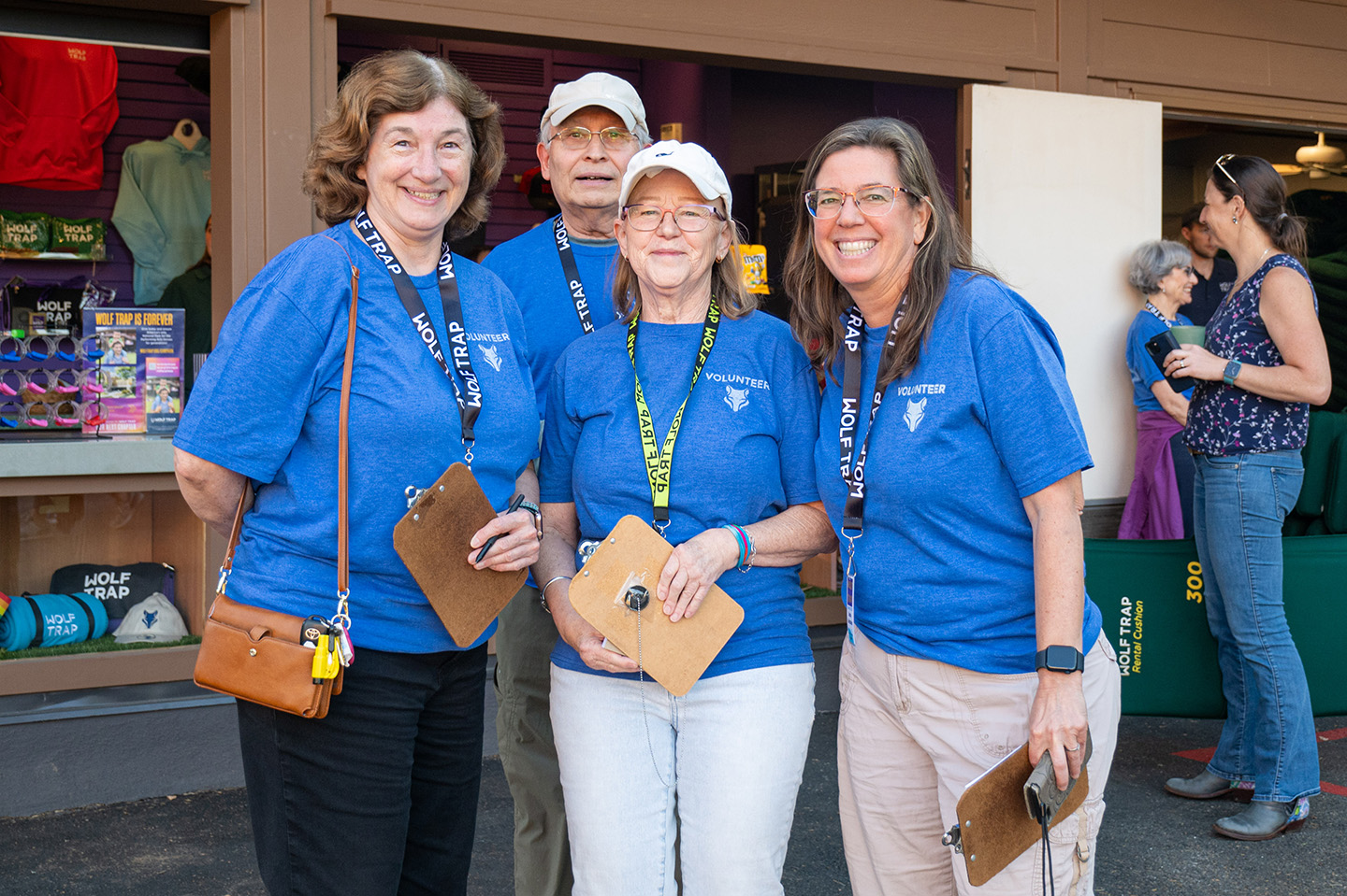 Wolf Trap volunteers pose in front of the gift shop.