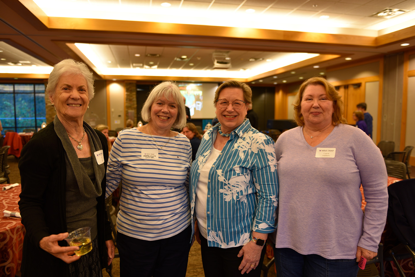 Four volunteers smile for the camera.