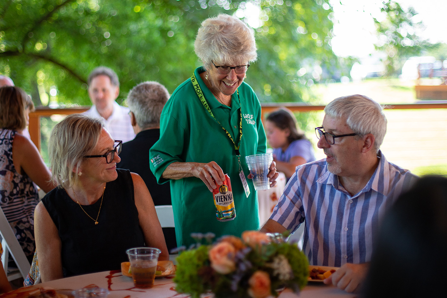 Phyllis Krochmal serves at a member dinner.