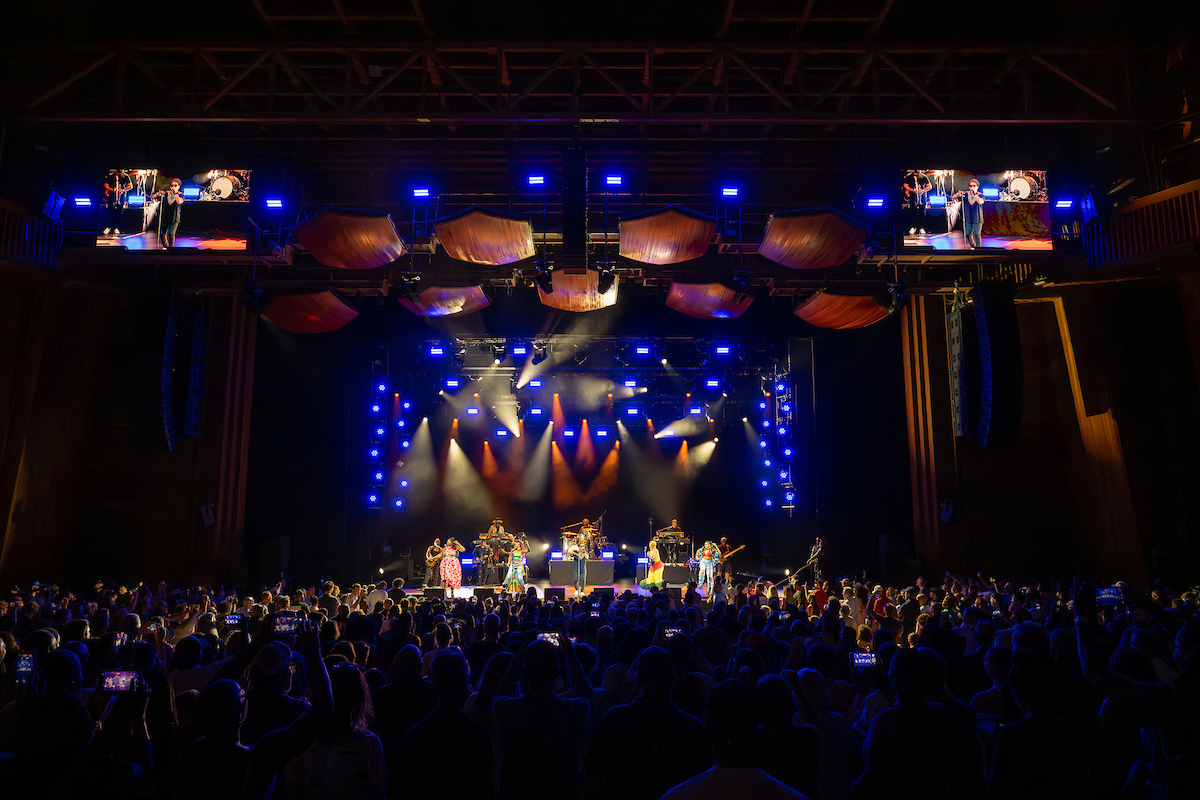 Brightly-lit concert on the Filene Center stage.