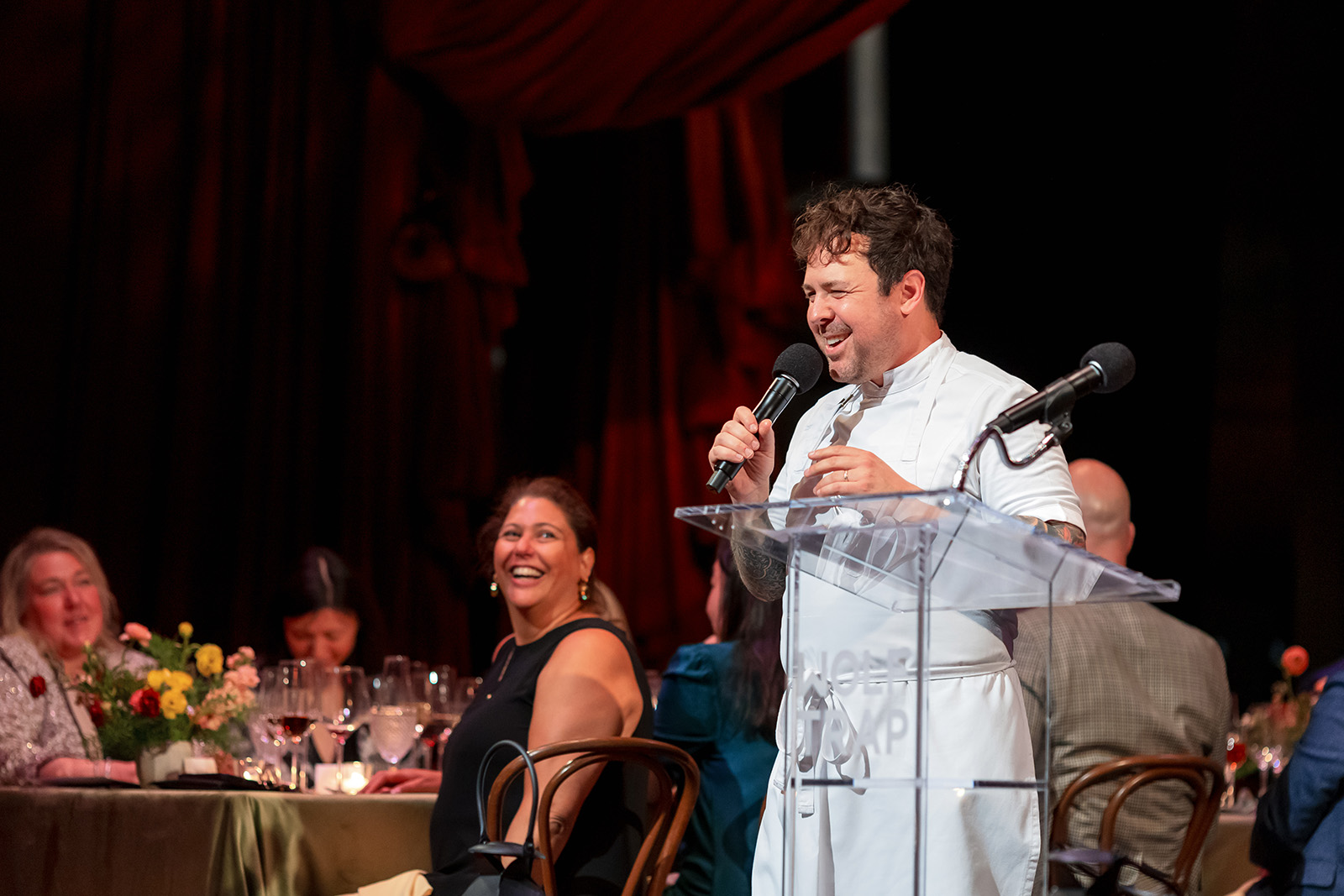 Chef Aaron Silverman speaking on stage at Wine & Dine at Wolf Trap.