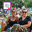 Bingo card item "Enjoy a show from the lawn" checked off next to a photo of friends wearing sunglasses and smiling on the lawn.